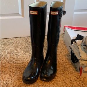 Black tall hunter boots